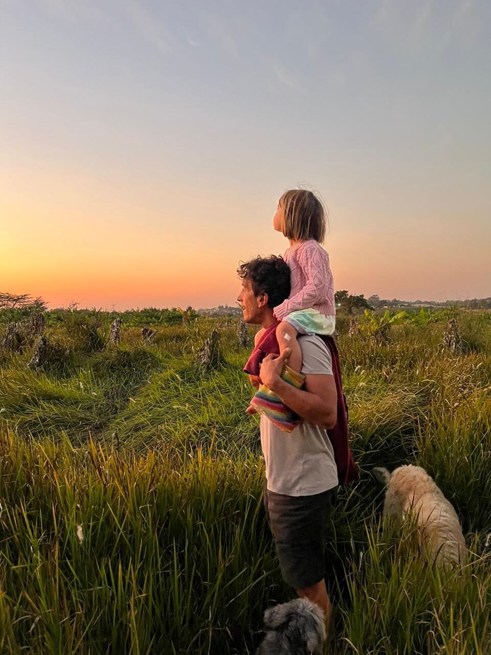 Gonzalo and his daughter on the land at sunset